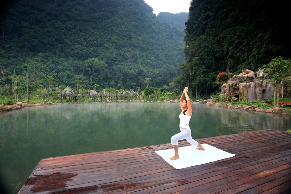 The Banjaran Hotsprings Retreat Hotel Ipoh Exterior photo A woman practicing yoga at the resort